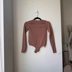 Skims Essential Crew Neck Long Sleeve Bodysuit in Sienna - Size Small/Medium